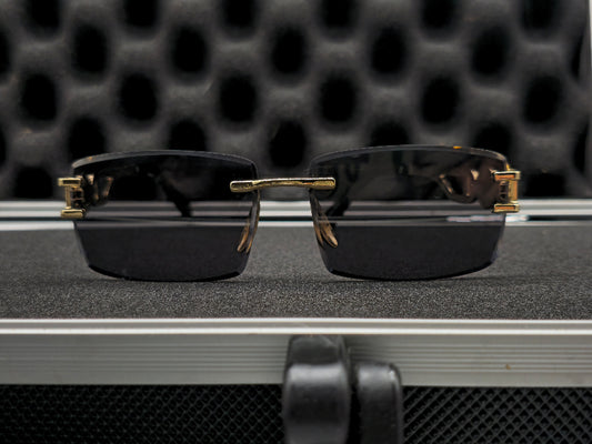 C4rtier negro y dorado