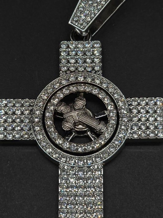 Cruz pendant giratorio