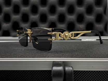 C4rtier negro y dorado